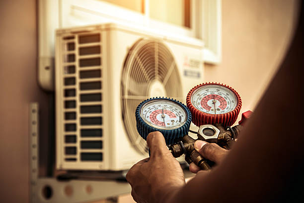 Professional Air Conditioning Service technician working in Corvallis, OR